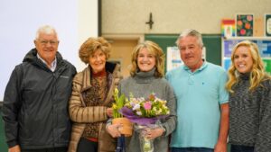 L to R: Teri's father Jim, Teri's mother Mary, Teri Herda, husband and staff member John Herda and daughter Lizzy Herda during assembly at Silver Beach Elementary School.